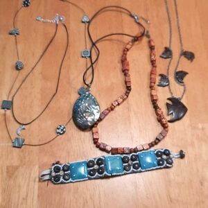 Womens bundle of wood and shell jewelry.